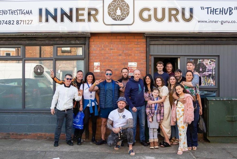 Community members outside Inner Guru on Walton Road